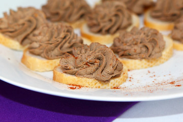 Bread and pate paste of meat sprinkled with pepper. A light snack before the meal. Ffood is simple and fast.
