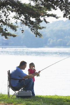 A Father And Daughter Fishing Together