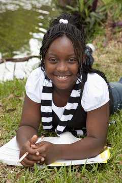 Fort Lauderdale, Florida, United States Of America; A Girl Doing School Work In The Park