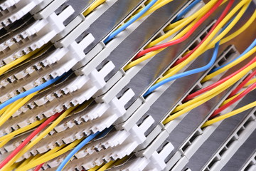 Telecommunication main distribution frame with colorful cables, close up