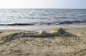 Fototapeta na wymiar The girl from the sand