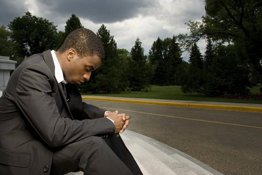Man Sitting On Steps