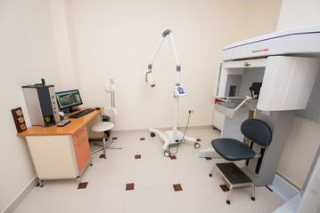 Dentistry office. Cabinet with modern orthopantomograph, dental panoramic x-ray machine to produce images in single shot entire dental system