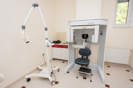 Modern orthopantomograph, dental panoramic x-ray machine to produce images in single shot entire dental system in dentistry office