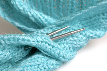 Piece of knitting work - blue yarn stitches - macro