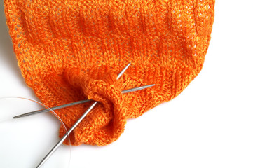 Piece of knitting work - orange yarn stitches - macro