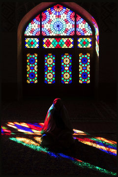 Persian girl in rainbow Mosque Nasir al-Mulk. Iran. Shiraz.