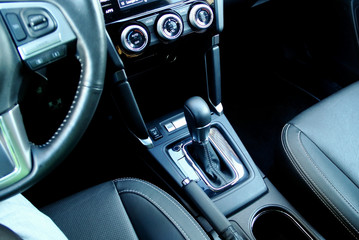 Top view of automatic gear shift knob inside the vehicle interior 