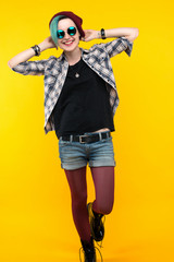 creative person style on yellow background. modern teenager. colour / colorful hairstyle