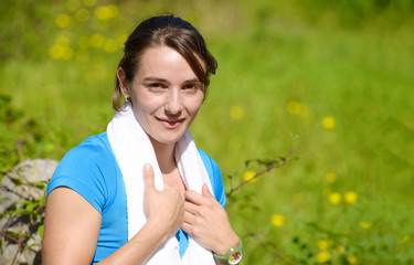 sporty young  woman relaxing after exercising