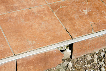 closeup of a  cracked tiles