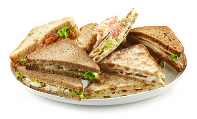 plate of various triangle sandwiches