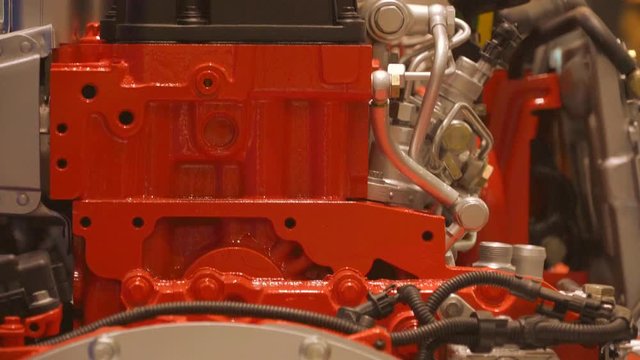 Transmission on a Modern Engine is Painted in Silver. Red Cylinder Block