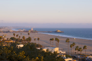 The Pacific Ocean is during sunset. Landscape with blue sea, the beach and the dusk sky, the USA, Santa Monica. 