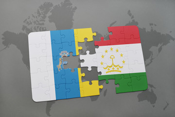 puzzle with the national flag of canary islands and tajikistan on a world map background.