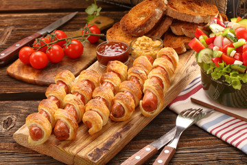 Frankfurters rolled sausages baked in puff pastry