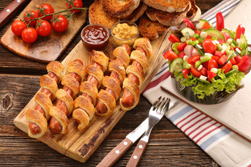 Frankfurters rolled sausages baked in puff pastry