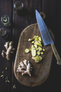 Sliced ginger on cutting board