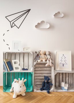 Modern children room inspiration. Vintage shelves and washi tape origami plane. © mallmo