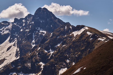 Rocky peaks and clouded sky in the Tatra Mountains in Poland.