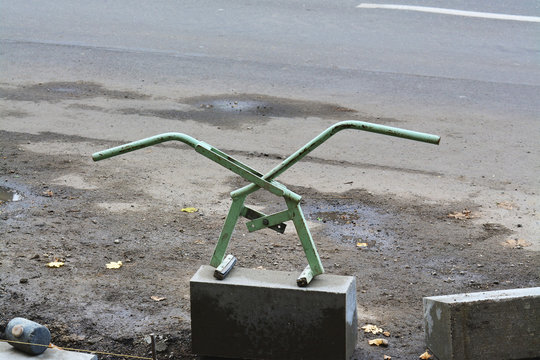 Adjustable lifter for manual handling of curbs. Scissor type manual kerb lifter.