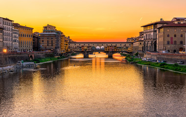 Sunset view of Ponte Vecchio over Arno River in Florence, Italy