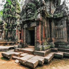Ancient Khmer architecture. Ta Prohm temple with giant banyan tree at Angkor Wat complex, Siem Reap, Cambodia travel destinations