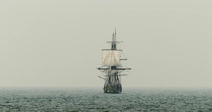 Wide shot of tall ship sailing in sea