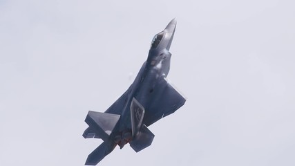 Tracking shot of fighter jet flying in the sky