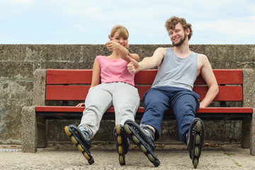 Young people friends relaxing on bench.