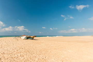 Fototapeta na wymiar Tropical beach with boat in Sri lanka.