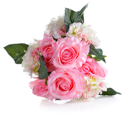 Artificial pink roses on white background