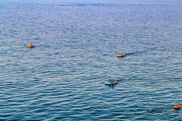 tourists on dinghy and pedal boat