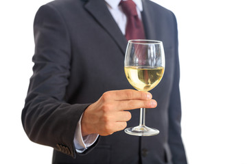 Man in suit drinking white wine
