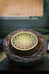 Artisan jewelers creating hand made jewelry items in a workshop.