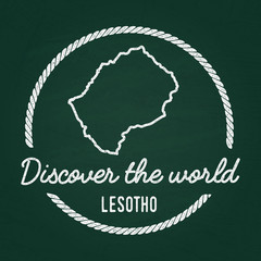 White chalk texture hipster insignia with Kingdom of Lesotho map on a green blackboard. Grunge rubber seal with country outlines, vector illustration.