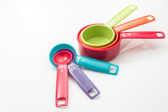 Measuring cups and spoons on a white background.