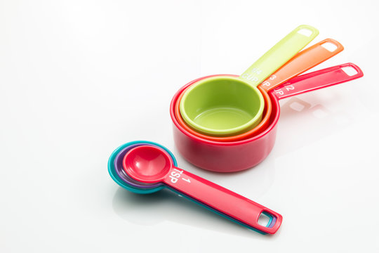 Measuring spoons and cups on a white background.