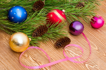 Pine tree branch with balls and fir cones 