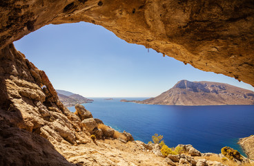 View of Telendos island from a cave in a cliff, Kalymnos island, Greece.