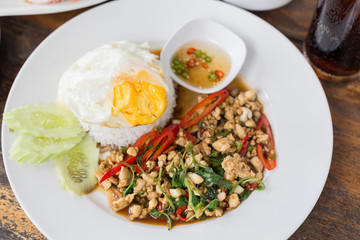 Close up Rice topped with stir fried minced pork and basil.
