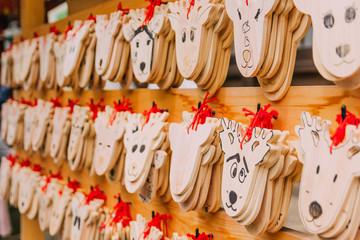 Wooden prayer tablets in Kasuga-taisha shrine in Nara. Wooden prayer tablets in Nara are uniquely design as a deer which is considered divine and sacred.
