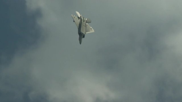 Slow motion of F22 fighter plane flying in sky