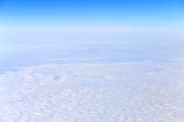 View from airplane on white clouds