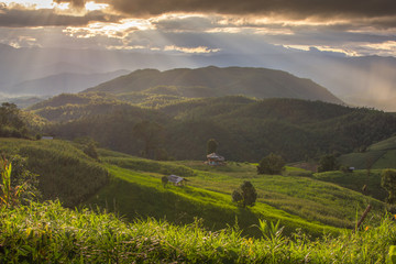 The mountain with background ray lighting in the evening in Mae chaem, Chaing Mai, Thailand