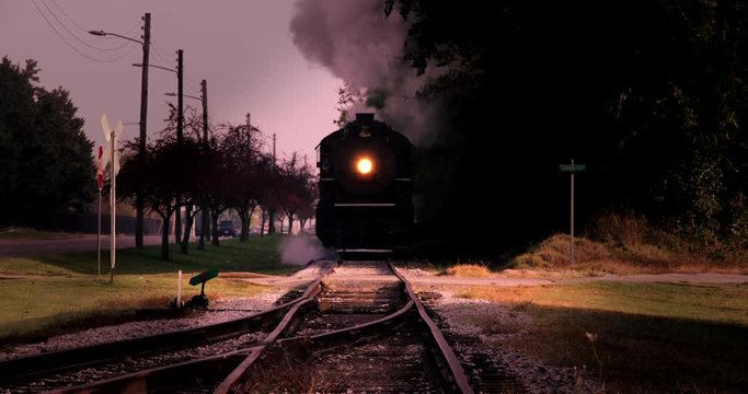 Wide shot of steam train moving on track