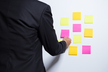 Businessman holding a notepaper