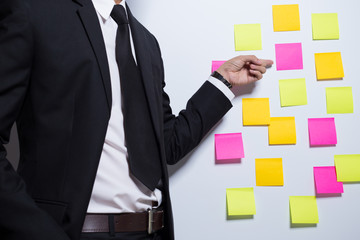 Businessman pointing to a notepaper