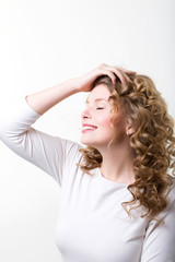 Fototapeta premium Portrait of a beautiful woman with curly hair.