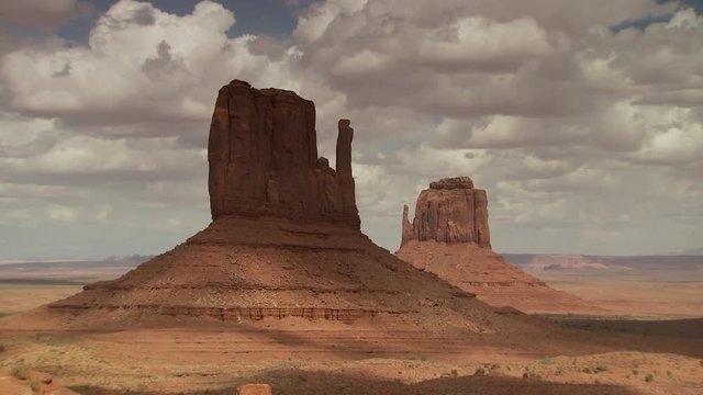 Rock formation in Monument Valley against cloudy sky